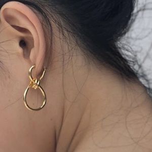 CELINE twisted piercing earrings NWOT